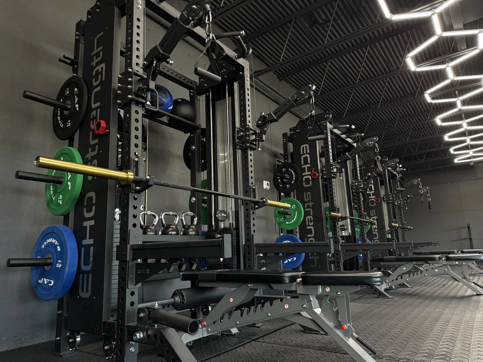 Wide interior view of The Heights Fitness studio — premium equipment, clean design, motivating atmosphere