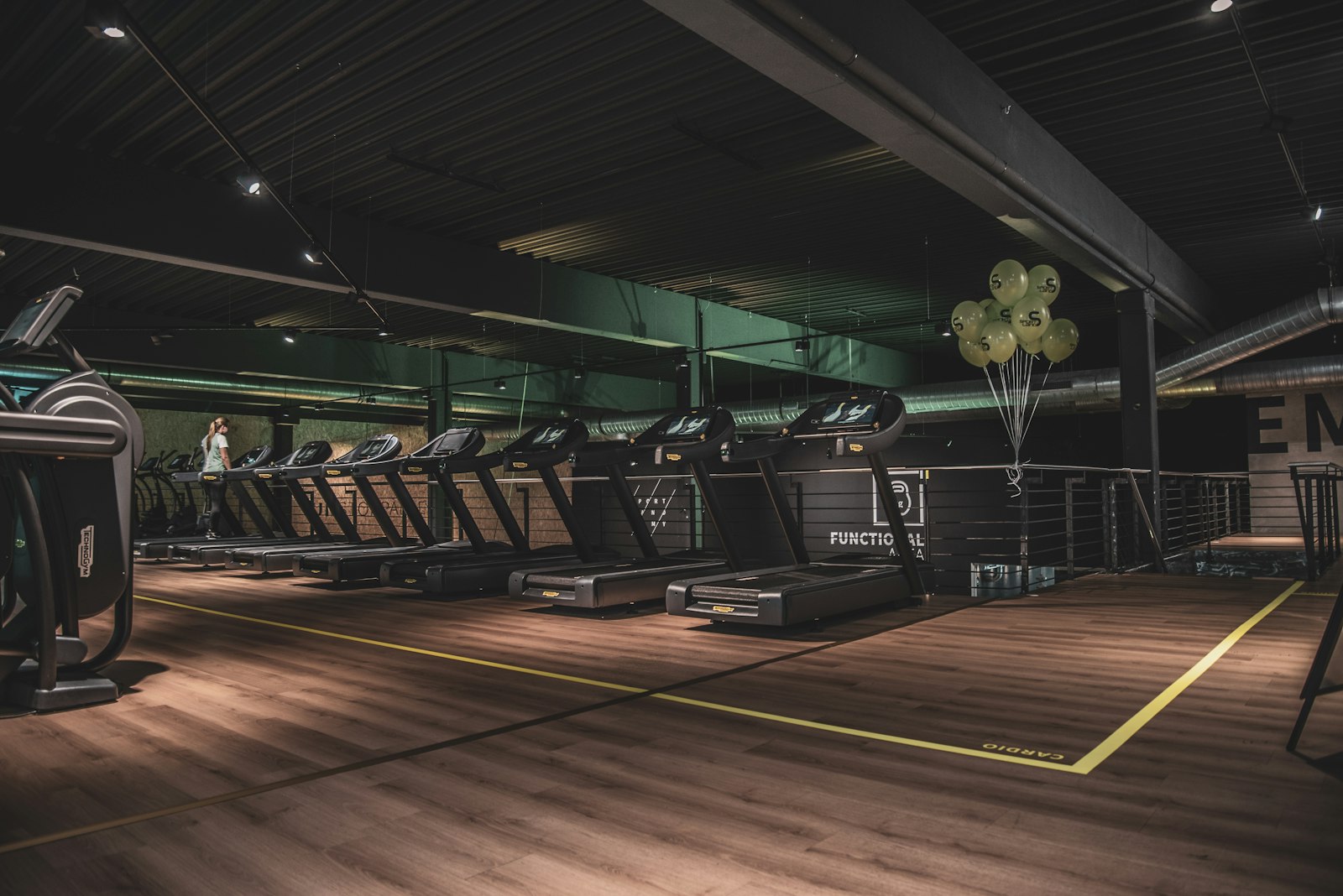 Wide interior view of The Heights Fitness studio — premium equipment, clean design, motivating atmosphere