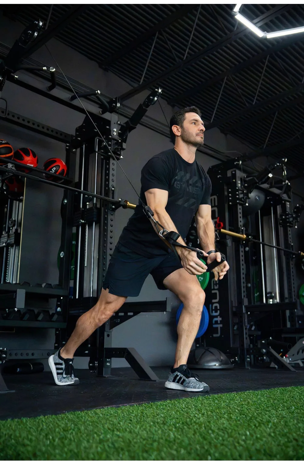 Personal trainer coaching client in a one-on-one session at The Heights Fitness